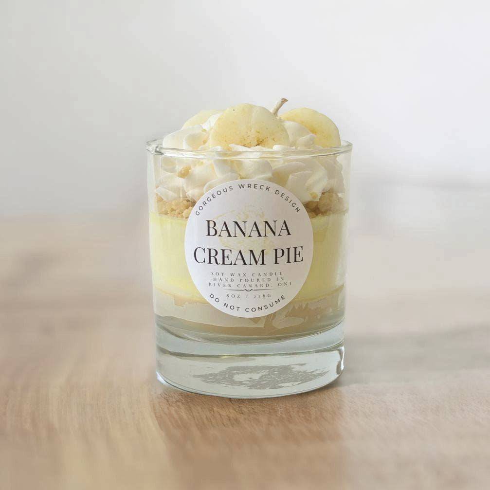 Candle in a glass jar labeled &
