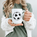 Rustic Girls Soccer Mama mug with black text and white ceramic surface, perfect for soccer moms.