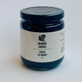 Jar of brandied cherries on a white background