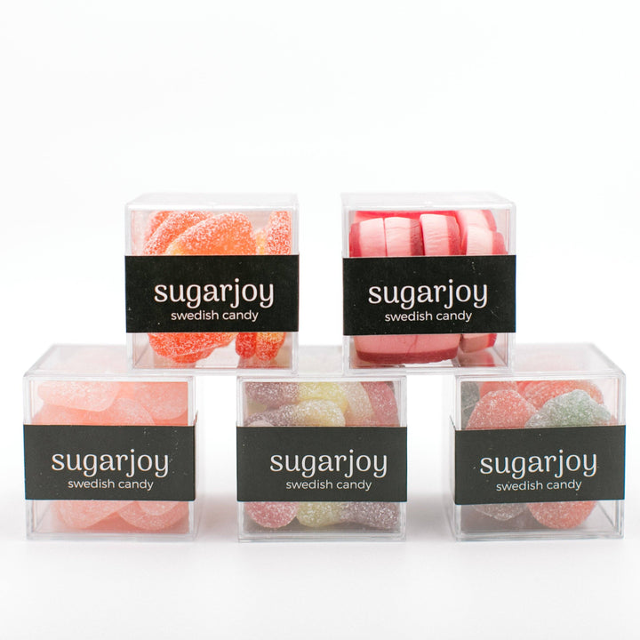 Five boxes of sugarjoy Swedish candy on a white background