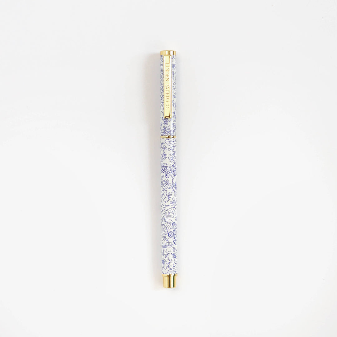 Decorative pen with crystal design on a white background
