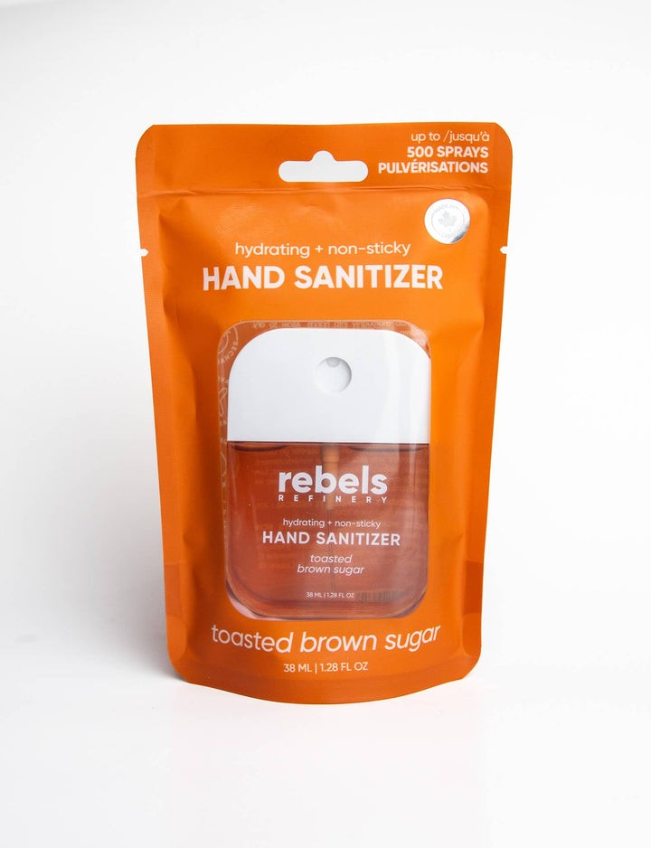 Orange package of rebels Toasted Brown Sugar hand sanitizer on a white background