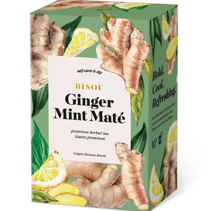 Bisou Ginger Mint Mate tea box with ginger root, mint leaves, and lemon slices on a green background.