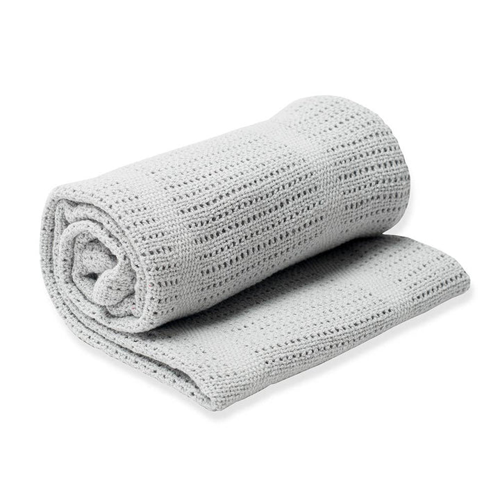Rolled-up gray textured blanket on a white background