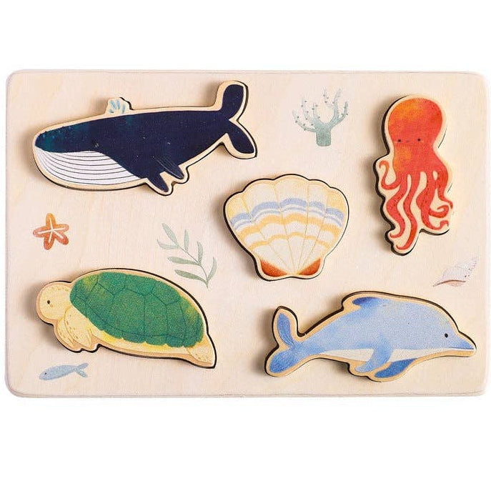 Wooden puzzle with sea-themed wooden pieces on a white background