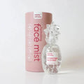 A pink hydrating face mist product with a clear bottle and a label that reads 'FACING MIST' and 'HYDRATING FACE MIST' from Rebels Refinery.
