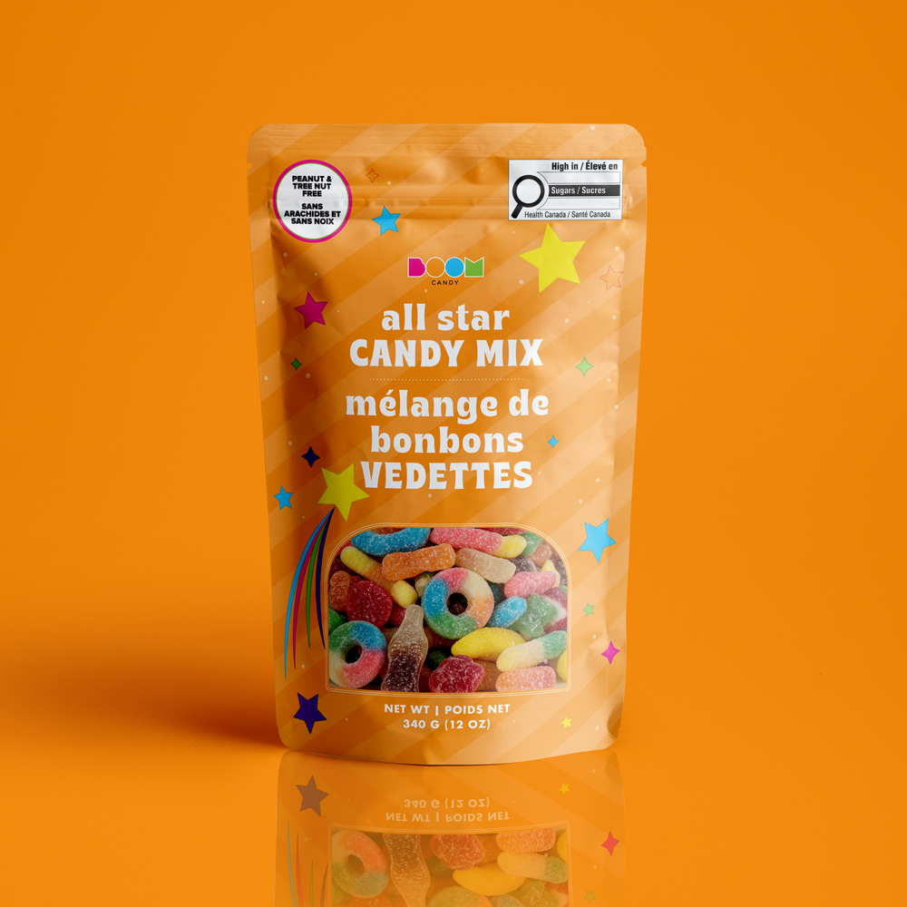 A stand-up pouch of Bood Candy 'all star CANDY MIX' on a solid orange background with a reflection below. The packaging is orange with colorful star graphics and a clear window showing multicolored gummy and loop candies inside.