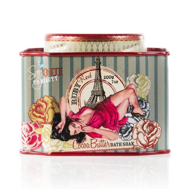 Barefoot Venus Ruby Red Bath Soak in a clear glass jar with red and gold accents, designed for relaxing spa and bath body use.