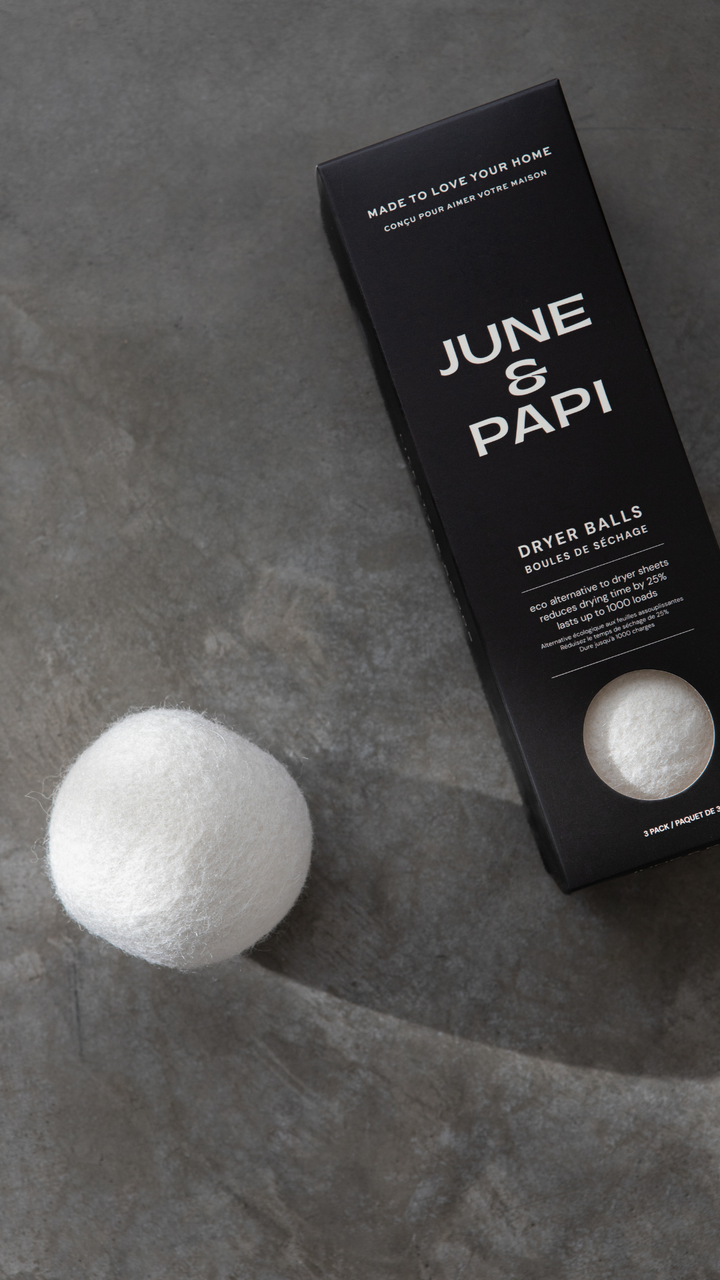June &amp; Papi dryer balls with packaging on a gray surface