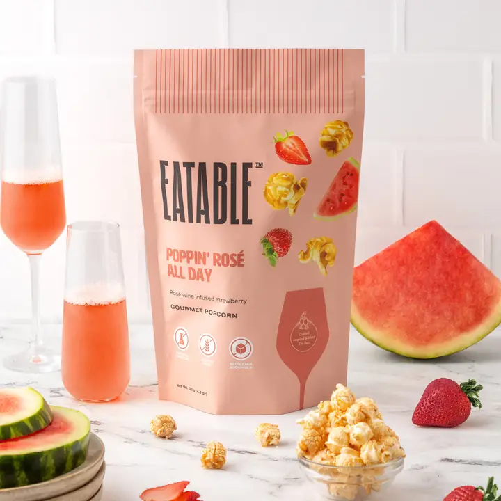 Eatable Poppin' Rosé All Day gourmet popcorn bag with watermelon and strawberry on a white background