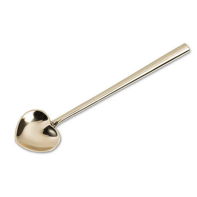 Gold spoon on a white background