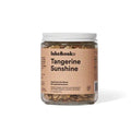 Jar of 'Tangerine Sunshine' tea blend with a pink label on a white background