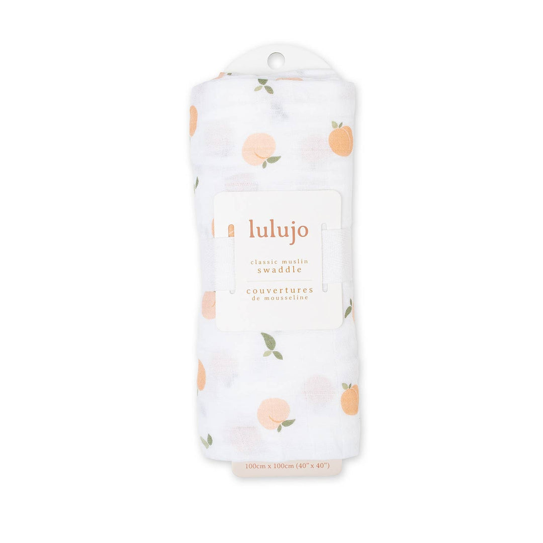 Lulujo swaddle blanket with peach pattern on a white background