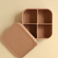 Brown bento box with lid on a beige background