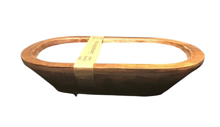 Wooden bowl with a yellow label on a white background