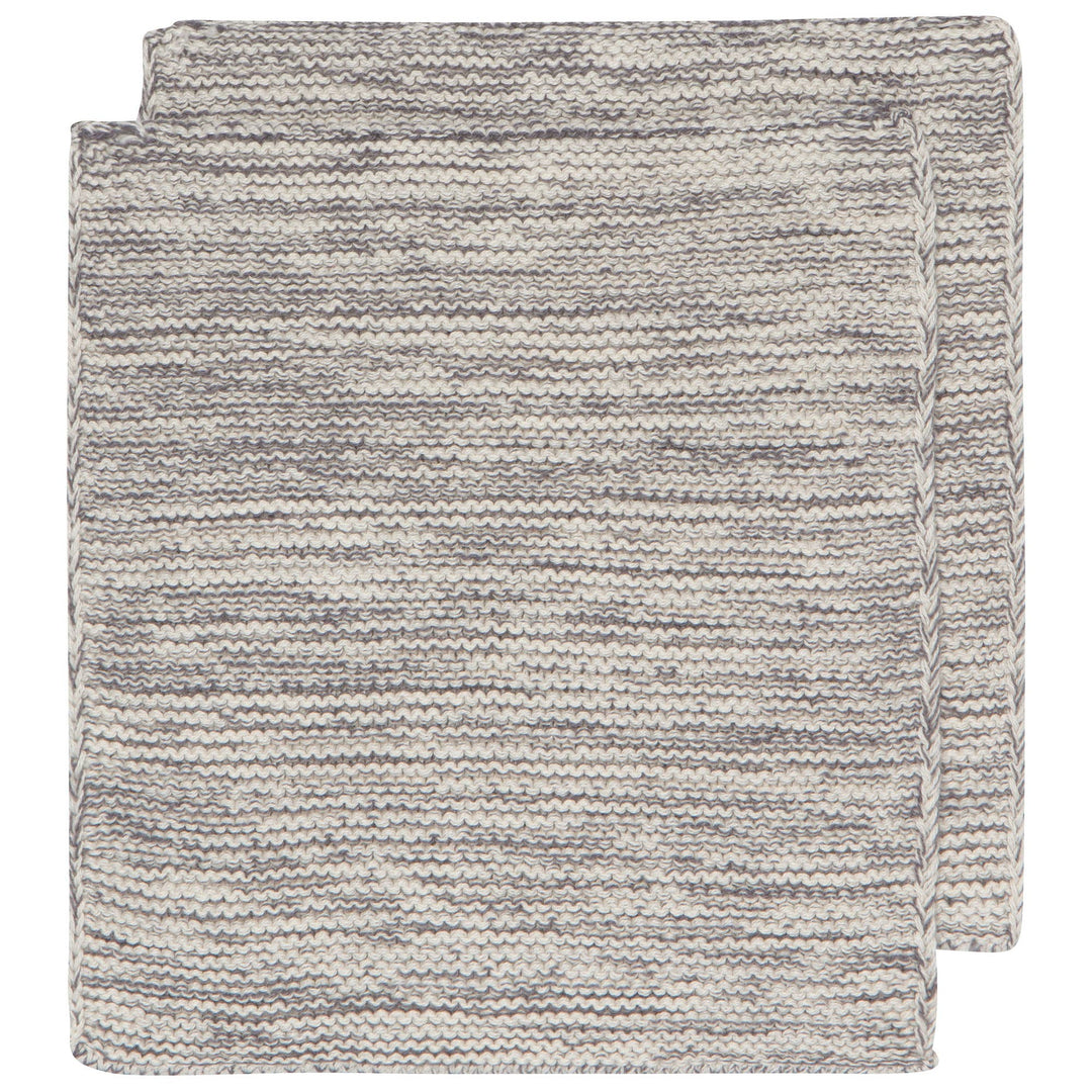 Two folded textured gray blankets on a white background