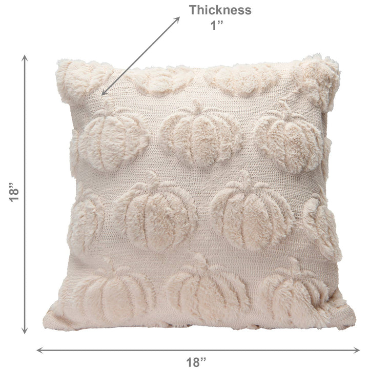 A cream-colored textured throw pillow with raised pumpkin motifs, shown with dimension lines indicating 18 by 18 inches and a thickness of 1 inch.
