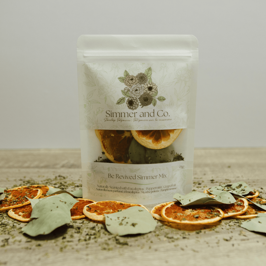 Simmer &amp; Co Be Revived simmer pot mix in a bowl, featuring dried herbs and spices for natural home fragrance.