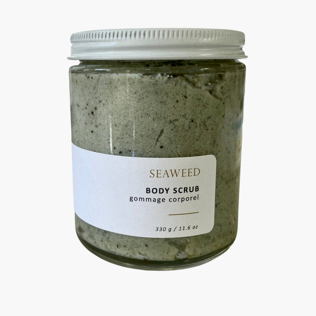 A jar of Seaweed Body Scrub with a white label and a silver metal lid, set against a plain white background.
