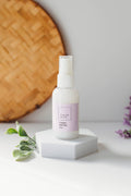 Mini lilac linen spray by The Fresh Wife Soap Company, houseware product with a spray bottle for freshening linens.
