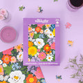 Villager 500 piece puzzle packaging with floral design on a purple background