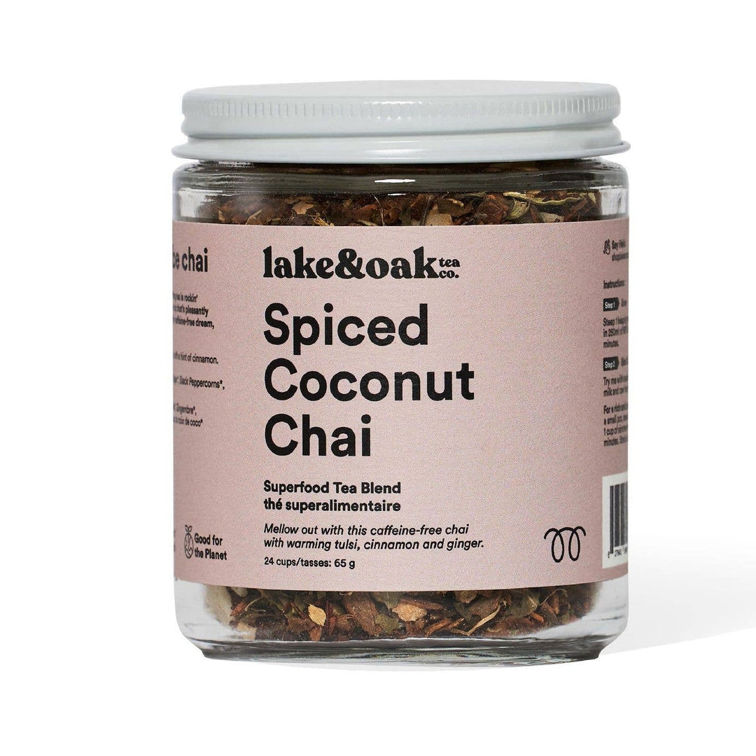 Jar of spiced coconut chai tea blend with a white lid on a white background