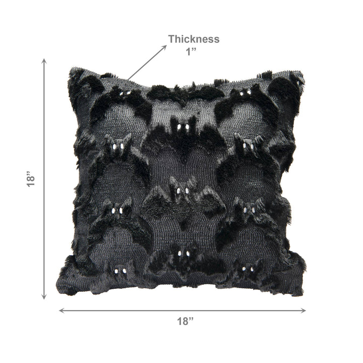 Black textured throw pillow with a raised bat pattern and small white bead accents, shown with dimension arrows indicating 18 by 18 inches and 1-inch thickness on a white background.