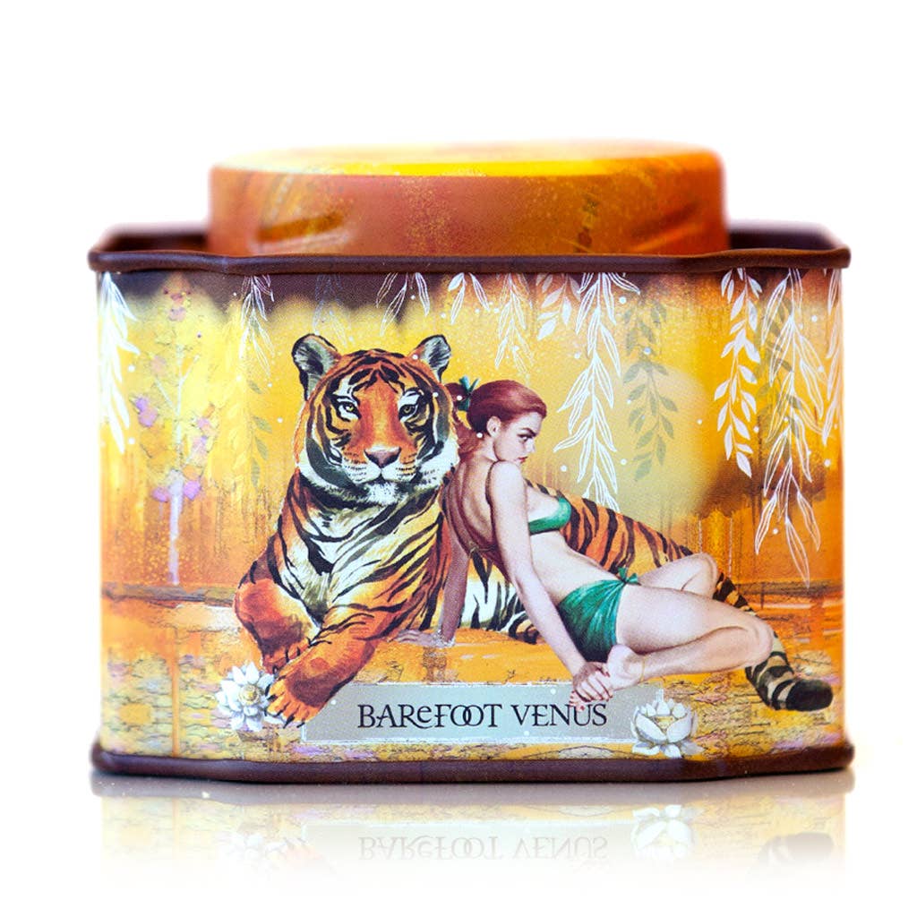 Tin container with a tiger and woman design, featuring the brand &