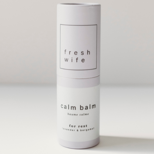 Cylindrical container labeled &