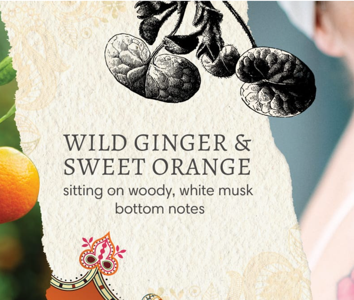 Product packaging with botanical illustration and text about wild ginger and sweet orange.