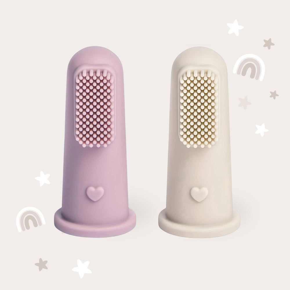 Two silicone fingerbrushes, one purple and one beige, on a light gray background.
