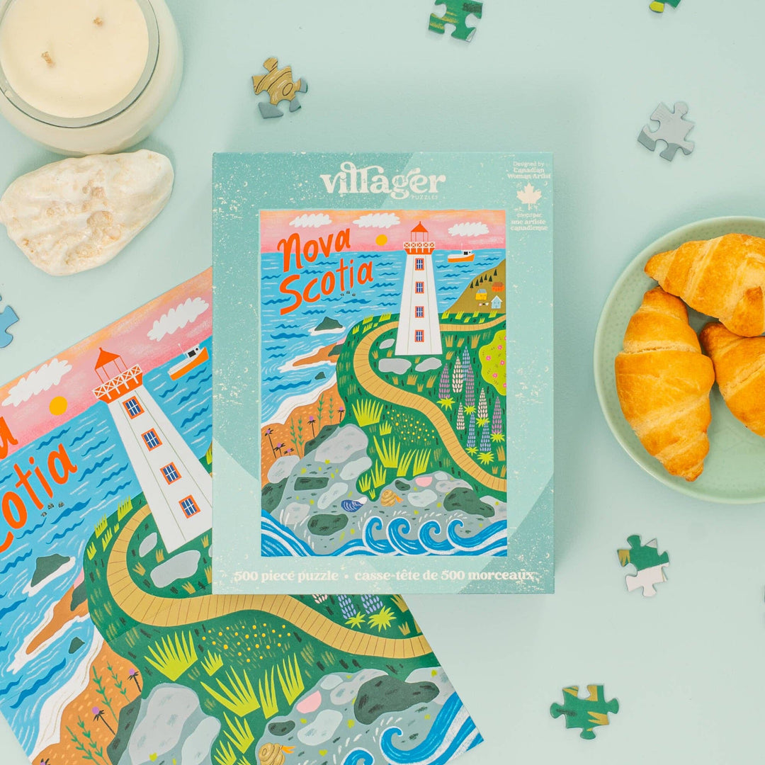 Villager Nova Scotia puzzle packaging with a lighthouse illustration on a light blue background.