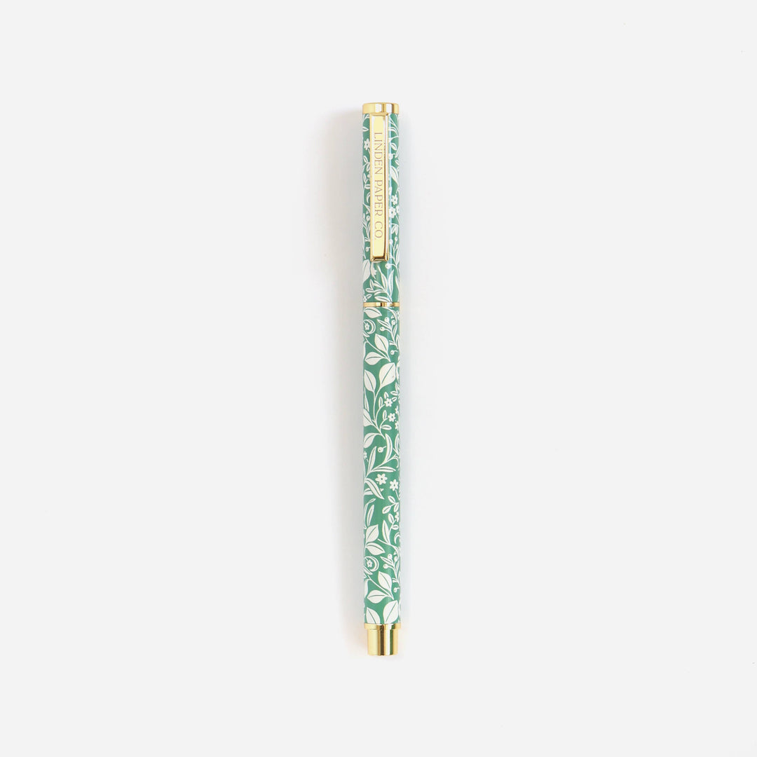 Green pen with floral pattern on a white background