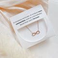 Sweet Three Designs infinity necklace with delicate chain and infinity pendant, showcasing elegant jewelry design.