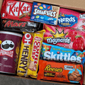 Assorted chocolate and candy gift box from Gift Smack Gift Company with a variety of sweet treats in colorful packaging.