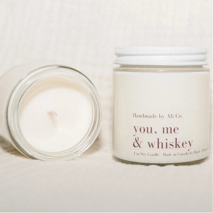 Candle and jar labeled &