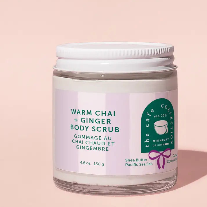 Jar of Warm Chai + Ginger Body Scrub on a pink background