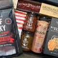 Ultimate spicy gift box by Gift Smack Gift Company featuring an assortment of hot sauces and spicy snacks.