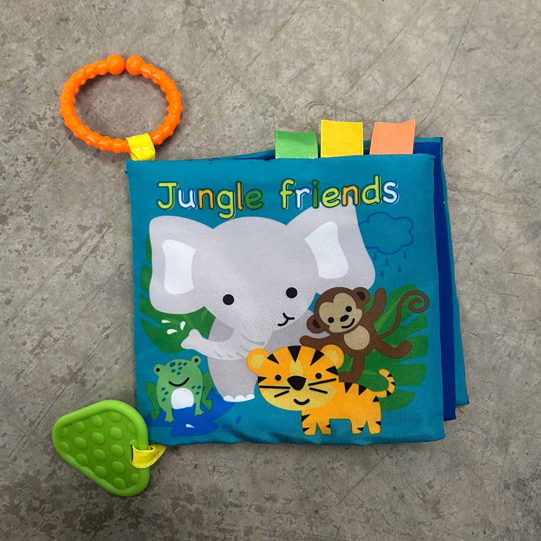 Children's book titled 'Jungle Friends' with elephant illustration on a concrete surface