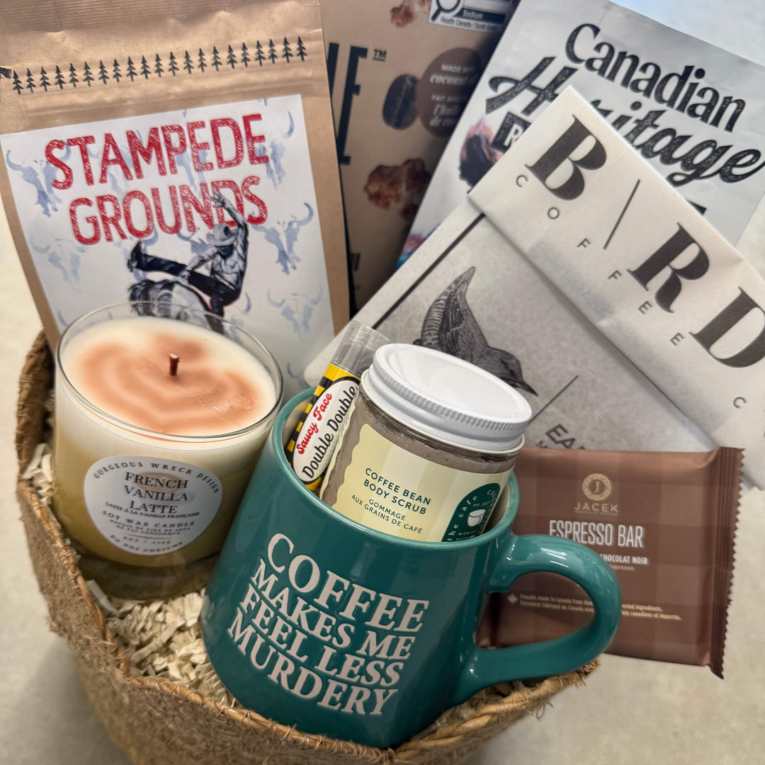 Candle, book, and coffee packaging on a textured surface