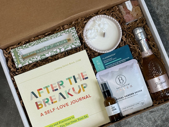 A curated gift box set containing a cream-colored self-love journal titled &