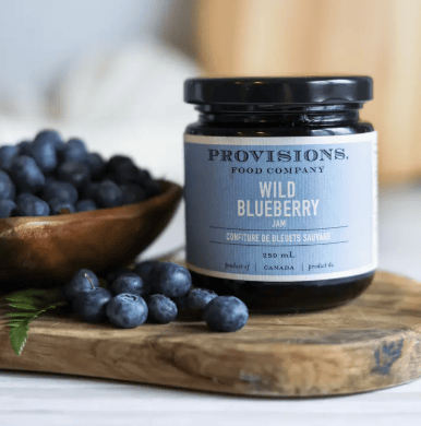 Jar of Provisions Wild Blueberry Jam from Provisions Food Company, showcasing a glass jar filled with vibrant blueberry jam.