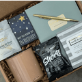 A gift box from Gift Smack Gift Company featuring self-care items for recovery, arranged in a stylish gift box.