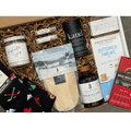 Canada Eh? gift basket by Gift Smack Gift Company featuring Canadian treats and souvenirs in a decorative gift box.