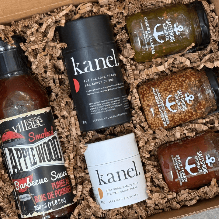 Collection of barbecue sauces and seasonings in a box