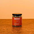 Jar of Rosso Vanilla Chai Tea from Rosso Coffee Roasters with vanilla and chai spices in a glass container.