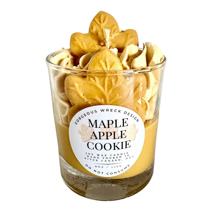 Candle in a glass jar labeled &