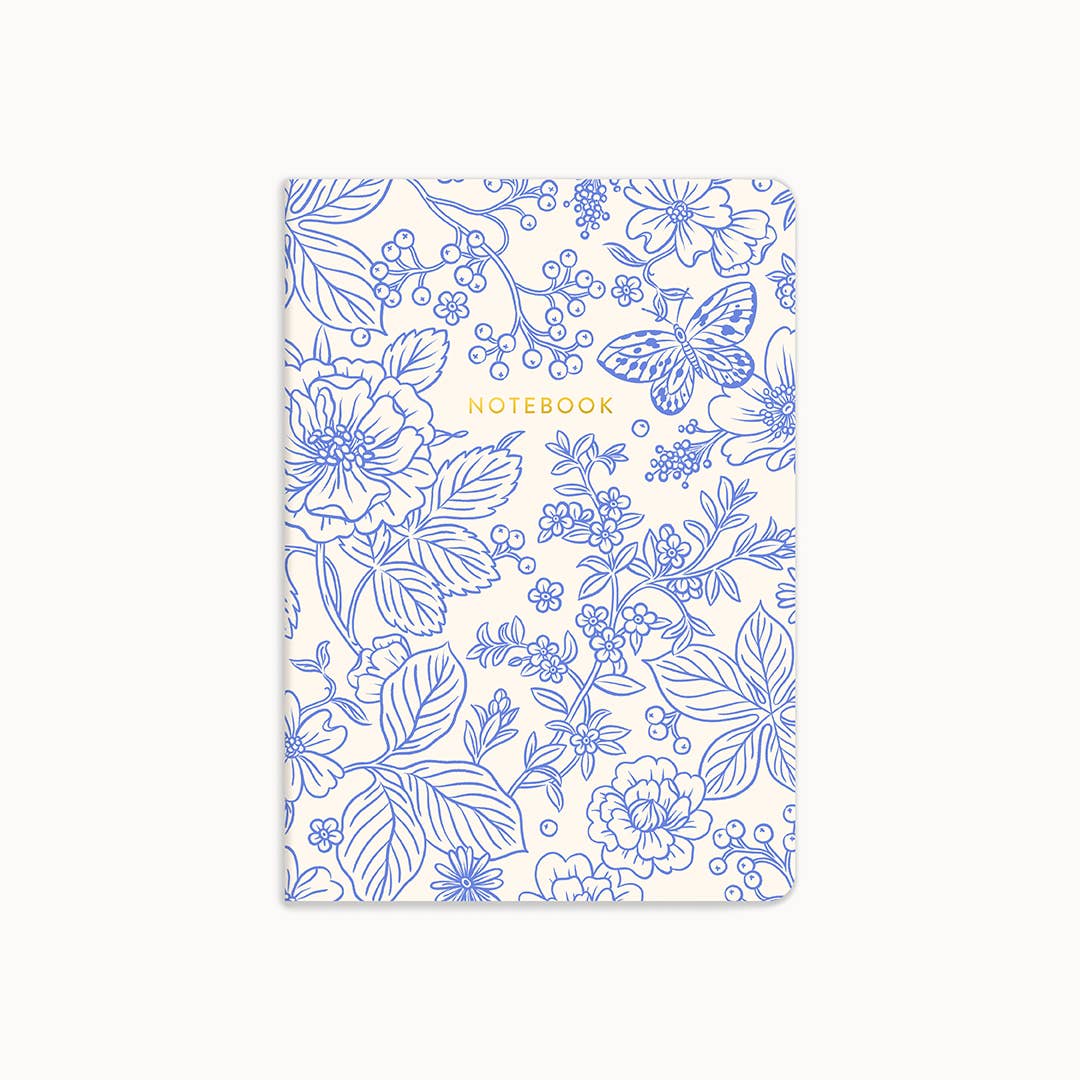 Notebook with blue floral pattern on a white background