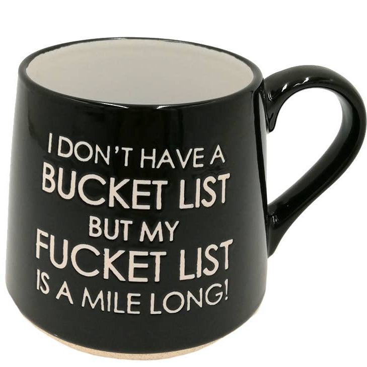 Black mug with humorous text on a white background
