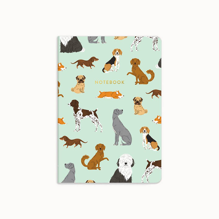 Notebook with dog illustrations on a light blue background
